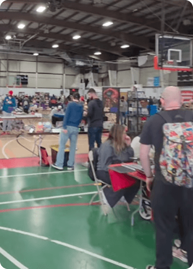 Trading cards and ocean decorations on a table at Ocean State Card Con